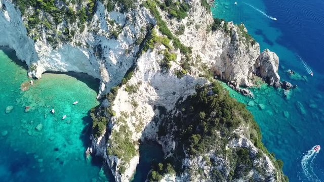 Aerial drone video from famous for Caretta caretta sea turtle haching, exotic small island of Marathonisi with white caves and sapphire sea and sandy beach , Zakynthos island, Ionian, Greece