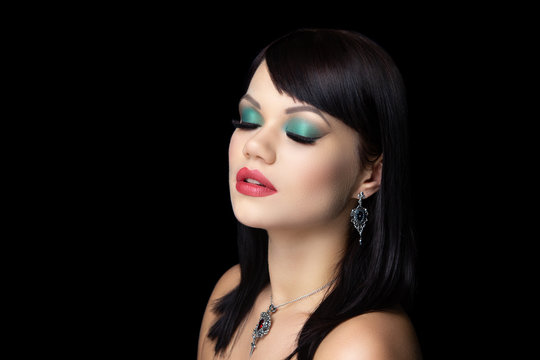 make up green eyeshadows and red lipstick