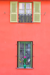 Nice, colorful facade, with typical windows and shutters
