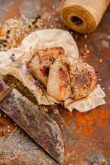 Raw fresh lamb meat and cleaver on dark background