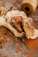 Raw fresh lamb meat and cleaver on dark background
