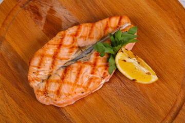 Grilled salmon served lemon and parsley