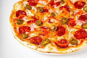 Pepperoni Pizza with Mozzarella cheese, salami, Tomatoes, pepper.