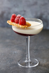 Layered panna cotta with raspberry, vanilla and amaretto biscuit