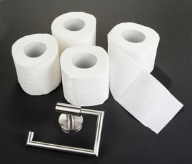 Toilet paper holder isolated on the black
