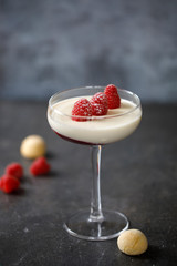 Layered panna cotta with raspberry, vanilla and amaretto biscuit
