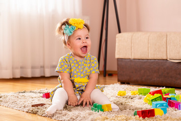 Playful baby girl smiling