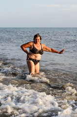 Woman in a swimsuit standing in the sea