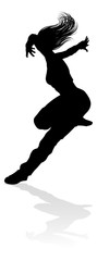 A woman street dance hip hop dancer in silhouette