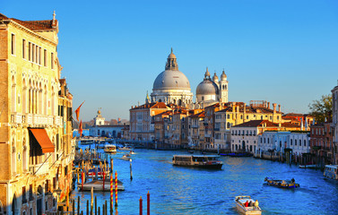 Beautiful view of Canal Grande with boats and tourists and Basilica Santa Maria della Salute in Venice,Italy