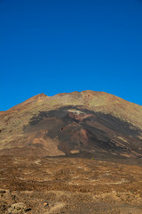 Closeup of Pico Viejo volcano crater against blue sky