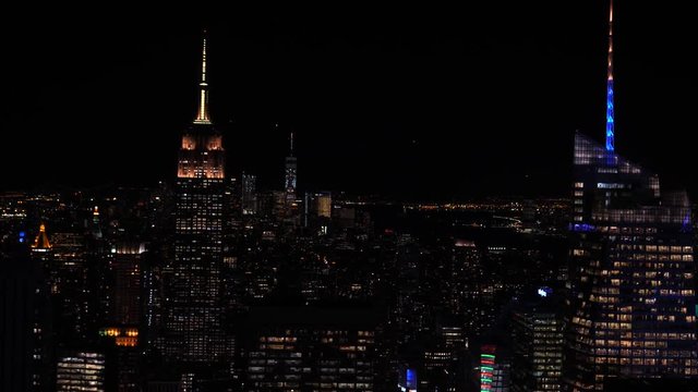 new york city skyline at night as seen from Rockefeller center focus pull