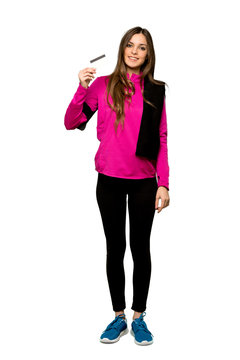Full-length shot of Young sport woman making a selfie over isolated white background
