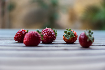 solated strawberries. Falling strawberry fruits whole and cut in half isolated on white background with clipping path - Imagen