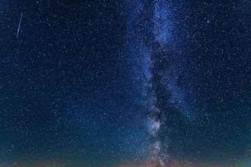 Bright night starry sky with millions of stars and galaxy Milky Way.