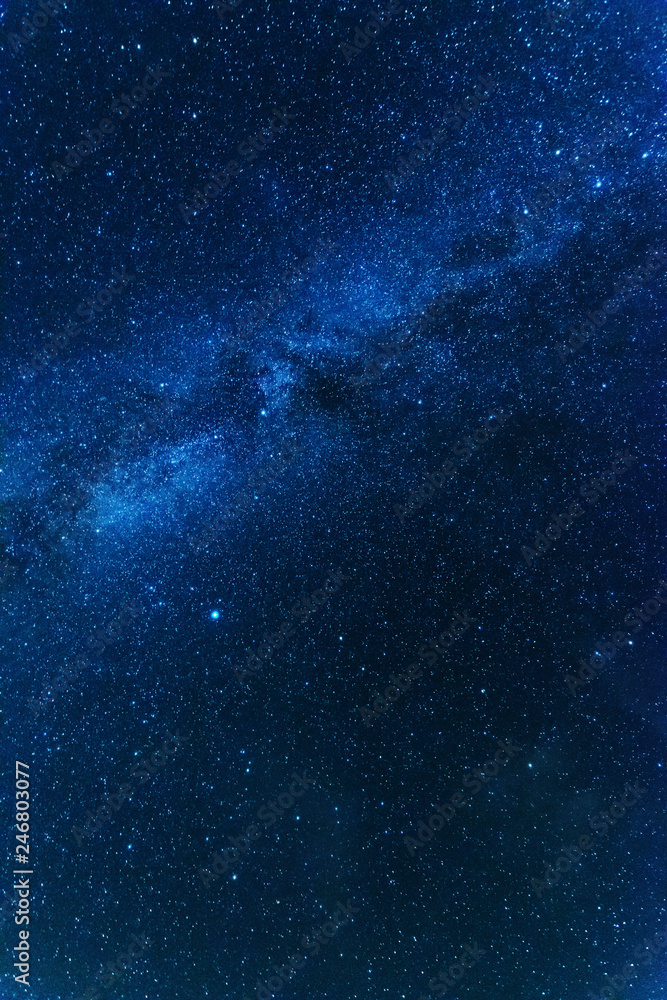 Wall mural bright night starry sky with millions of stars and galaxy milky way.