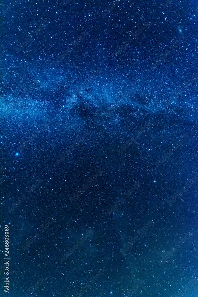 Wall mural bright night starry sky with millions of stars and galaxy milky way.