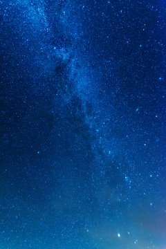 Bright night starry sky with millions of stars and galaxy Milky Way.
