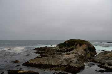 Fototapeta na wymiar Seascape along the 17 Mile Drive in overcast day. California, USA