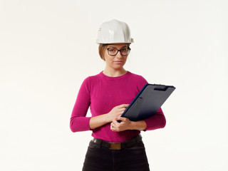 emotional girl foreman in a helmet on a white background.