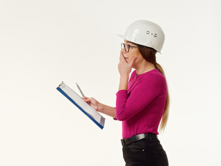 emotional girl foreman in a helmet on a white background.