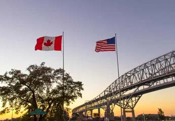 Acrylic prints Canada International Border Crossing. Sunset at the Blue Water Bridge border United States and Canada crossing. The bridge connects Port Huron, Michigan and Sarnia, Ontario.