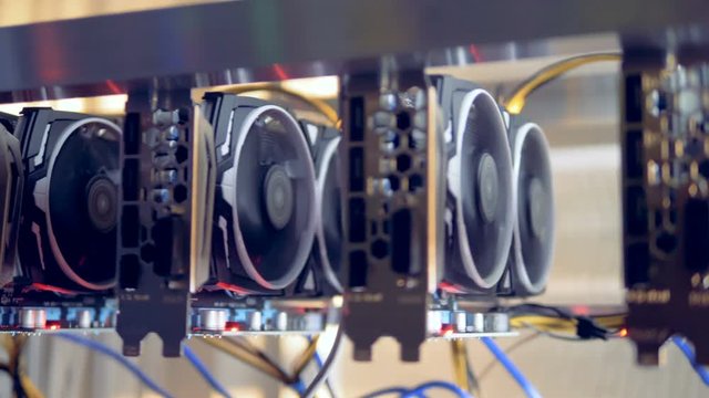 Bitcoin miners set up on shelfs. Mining cryptocurrency. Bitcoin concept.