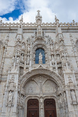 Fototapeta na wymiar Facade of portal of Jeronimos or Hieronymites monastery in Lisbon city, capital of Poartugal