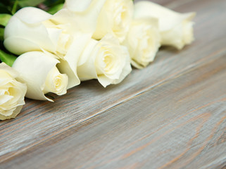 White Rose. A bouquet of delicate roses on a white background. Place for text, close-up. Romantic background for spring holidays.