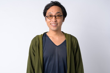 Portrait of happy Japanese man with eyeglasses smiling