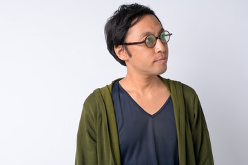 Portrait of Japanese man thinking against white background