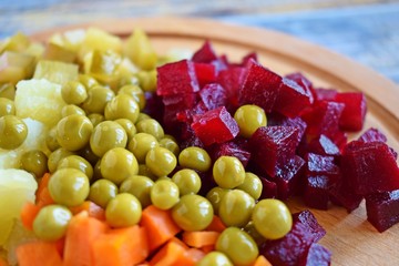 Chopped the ingredients for salad on a wooden Board.Vegetarian food.