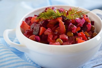 Vegetable salad with carrots and beets.Vinaigrette on a white plate.Vegetarian food.
