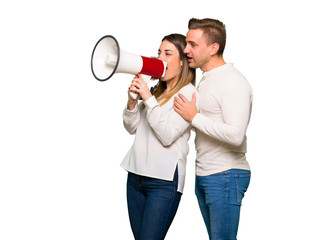 Couple in valentine day shouting through a megaphone