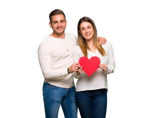 Couple in valentine day holding a heart symbol