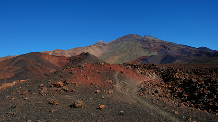 Volcanic landscape with lava Aa at Montana Samara hike, one of the most unusual alien-like environment found at Teide National Park, with views towards Pico del Teide, Pico Viejo and Las Cuevas Negras