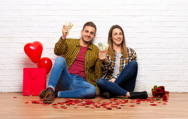 Couple in valentine day at indoors taking a lot of money
