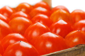 Fresh ripe persimmons in market. Persimmons background.