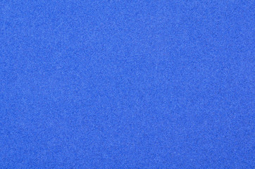 Background of blue velvet paper. Velvet texture close-up. Copy space velvet texture for your design.