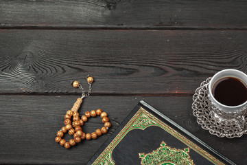 Three months. Islamic Holy Book Quran with rosary beads. Ramadan concept