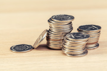piles of coins on working table