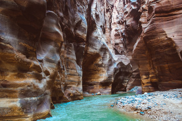 River canyon of Wadi Mujib in amazing golden light colors. Wadi Mujib is located in area of Dead...