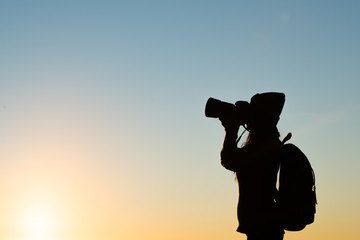 Silhouette of tourist woman standing in the mountain