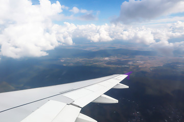 Fototapeta na wymiar Dramatic atmosphere panorama view of beautiful blue sky and soft white clouds from aircraft.