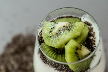 milkshake with kiwi in a glass glass. close-up, top view