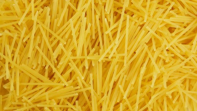 Spaghetti - yellow pasta, ready for cooking.