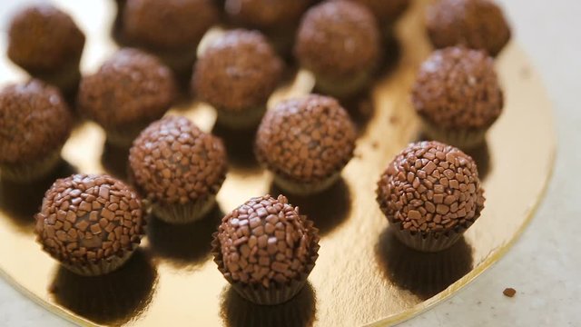 Process of baking homemade cake pops. Chef turning cake pop