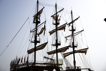 Antique pirate ship for excursions. Old ship. Turkish port. Alanya
