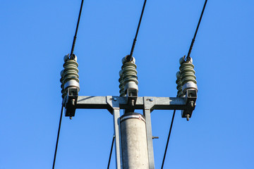 Obraz premium Silhouettes of High voltage pole and power lines