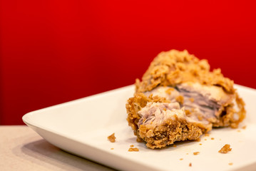 Crispy fried chicken kentucky with red background.
